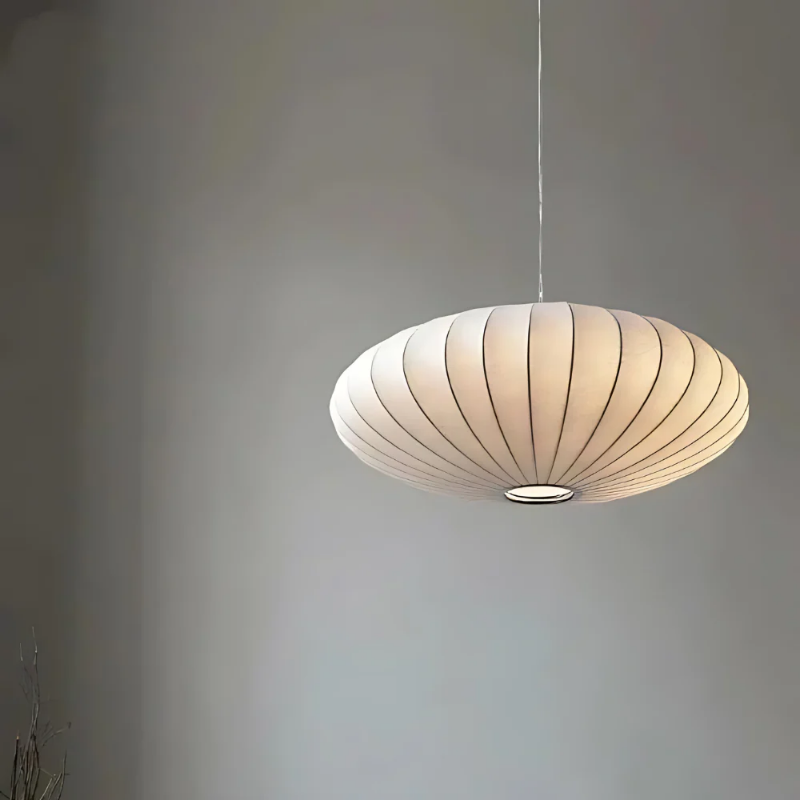 White oval ribbed pendant ceiling light suspended by a white cord