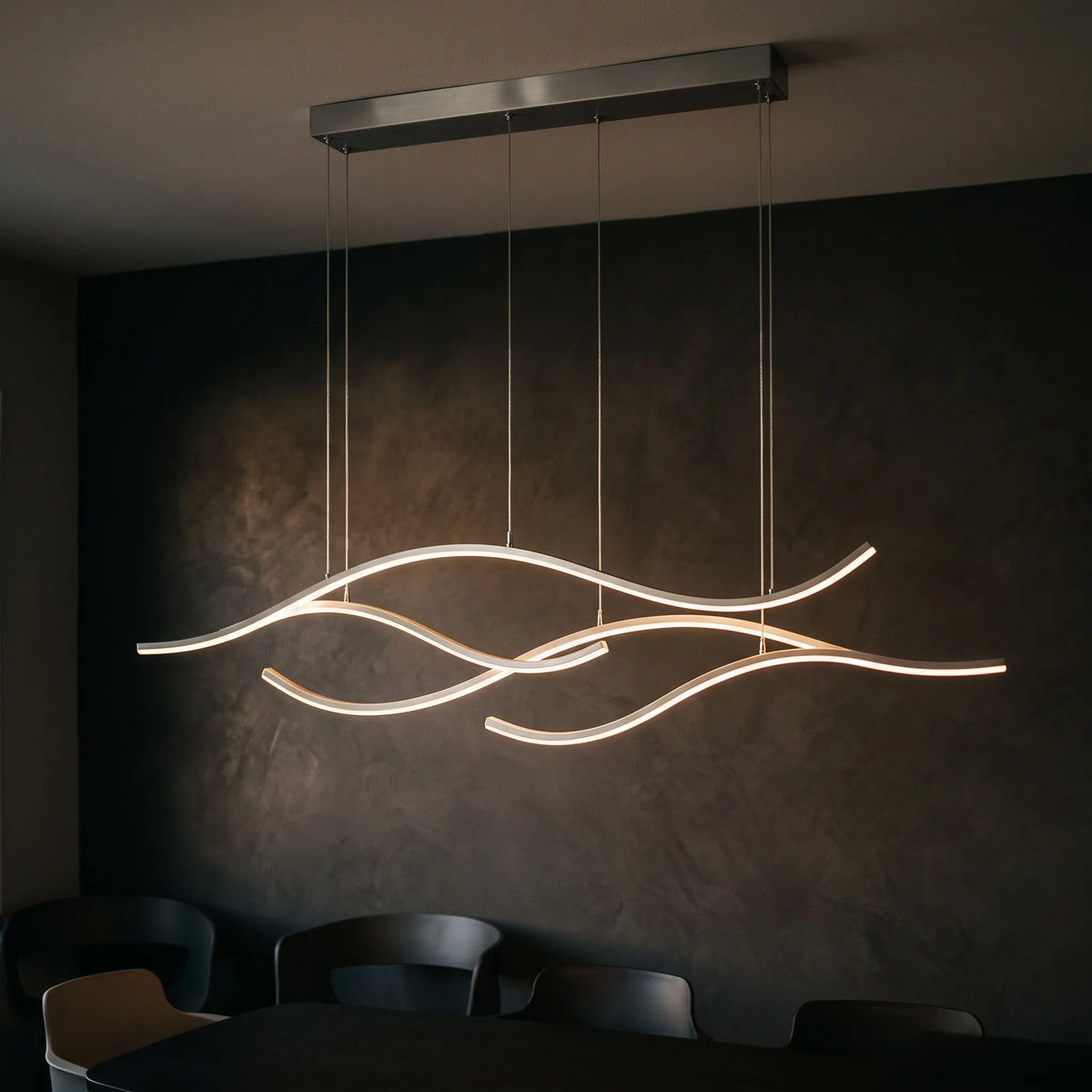Kallest - Curved Wave Linear Ceiling Pendant Illuminating A Central Kitchen Island