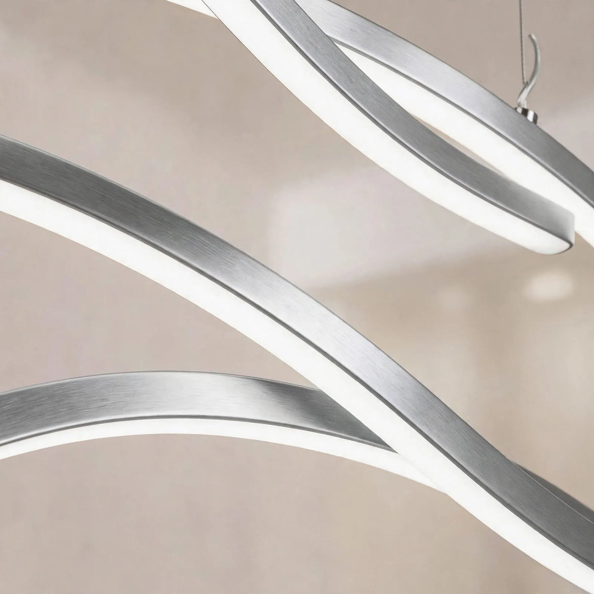 Kallest - Curved Wave Linear Ceiling Pendant Illuminating A Central Kitchen Island