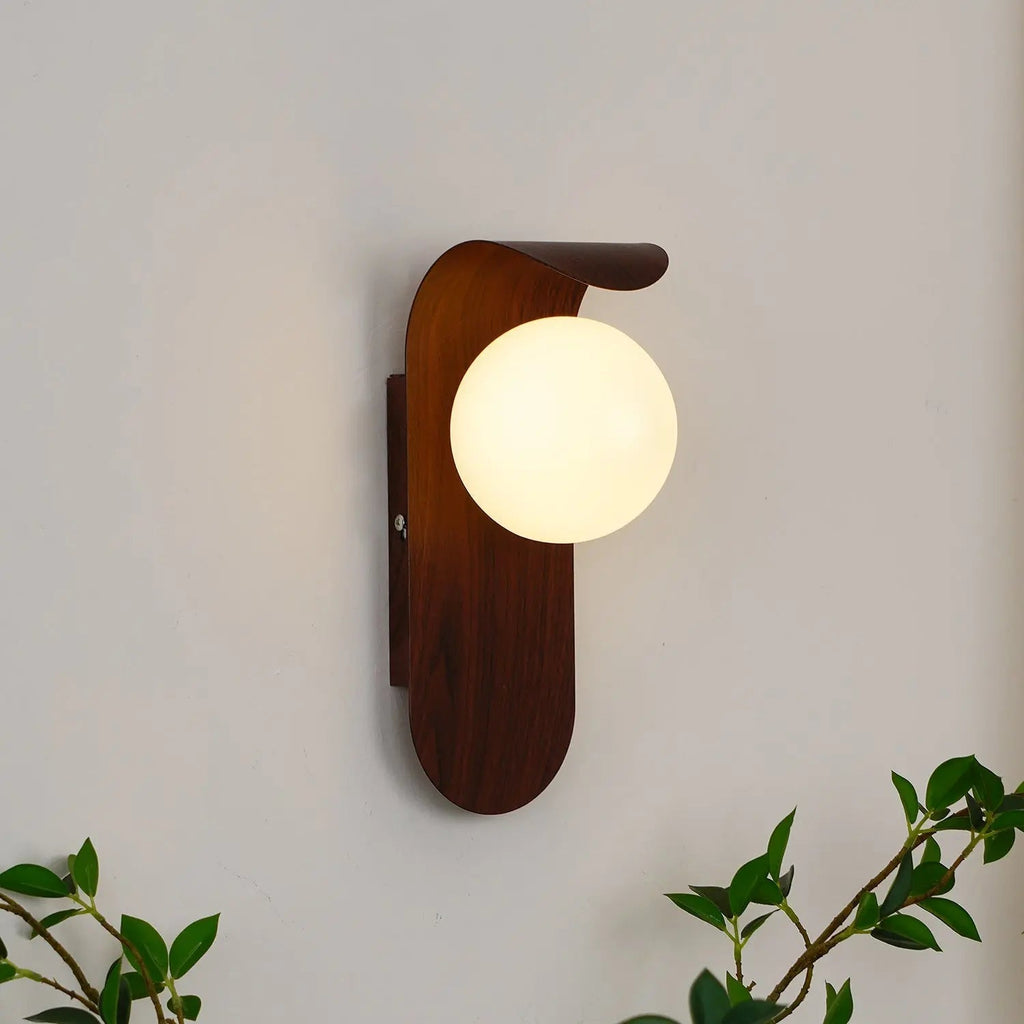 LED wall light with round globe and curved wood-effect panel