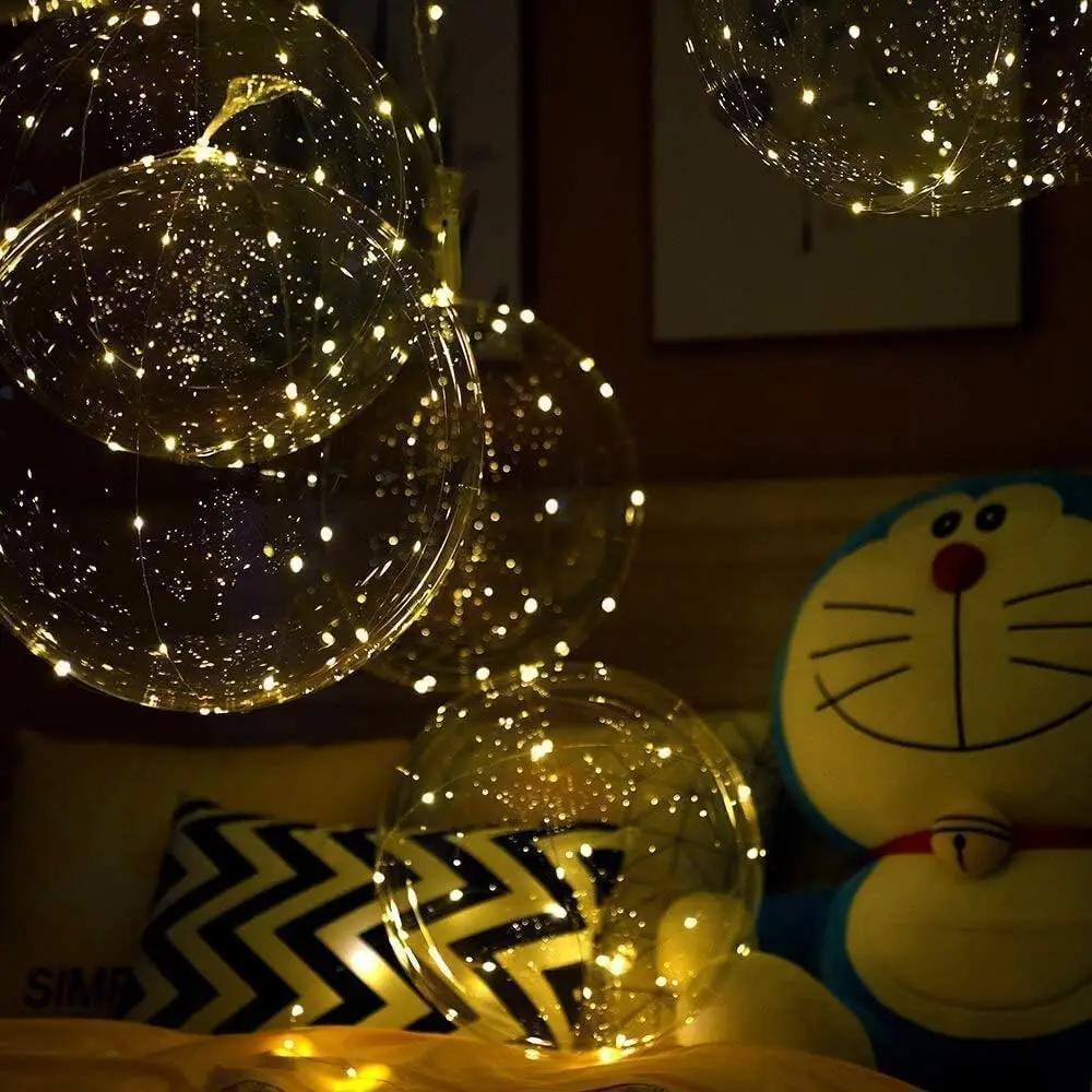 Clear balloons with warm white LED lights for party decoration