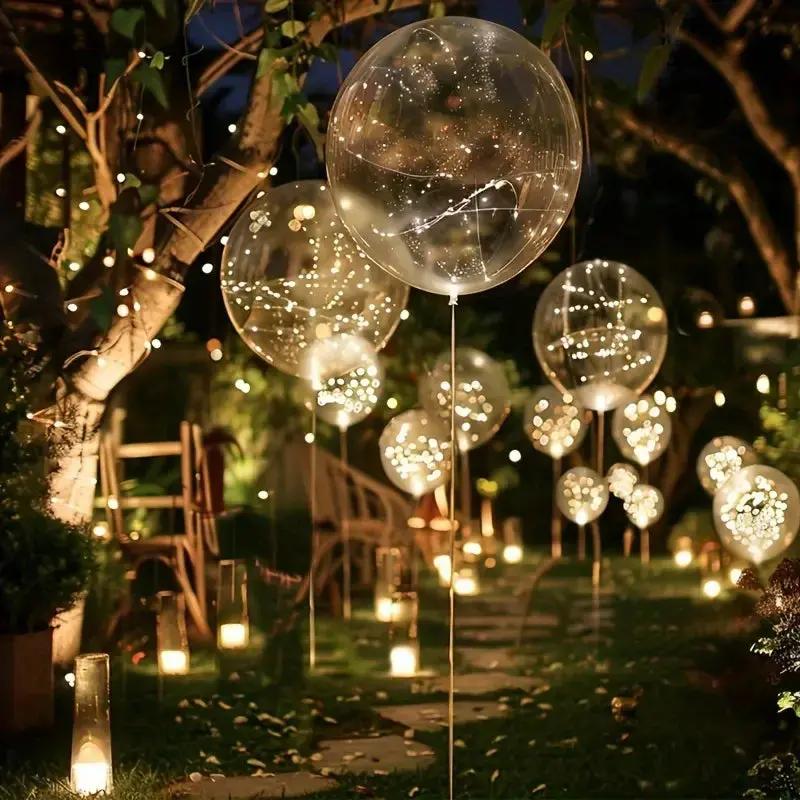 Clear balloons with warm white LED lights for party decoration