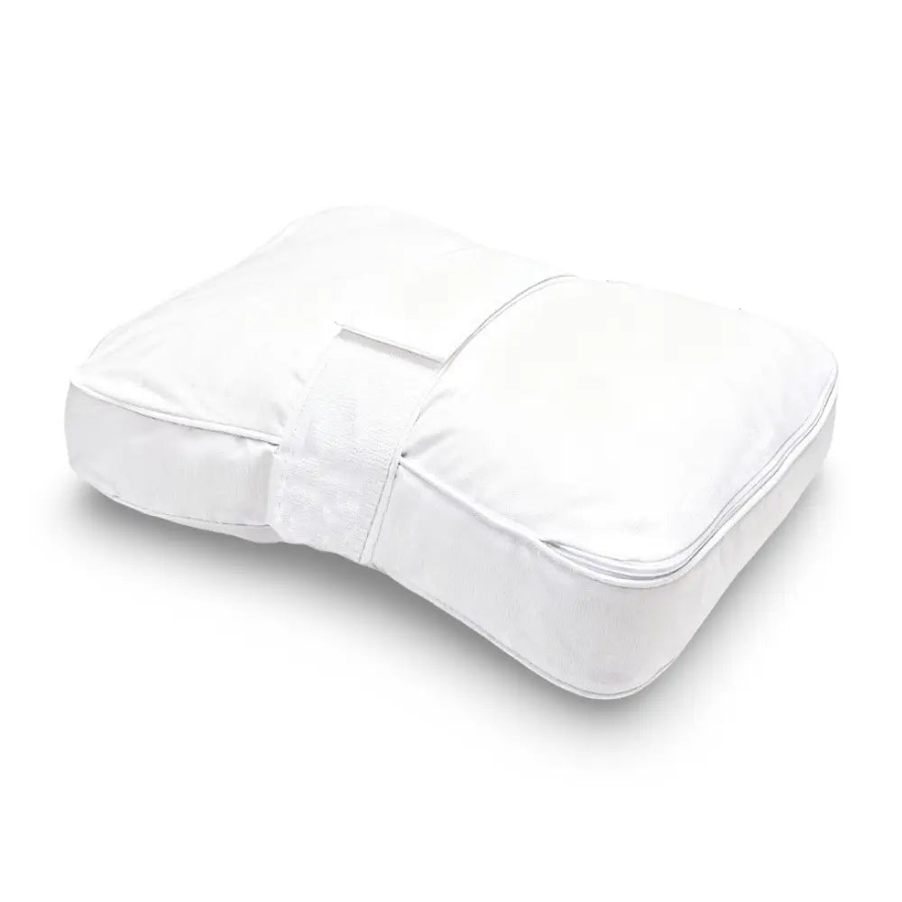Contoured memory foam knee pillow with attached leg strap between the legs