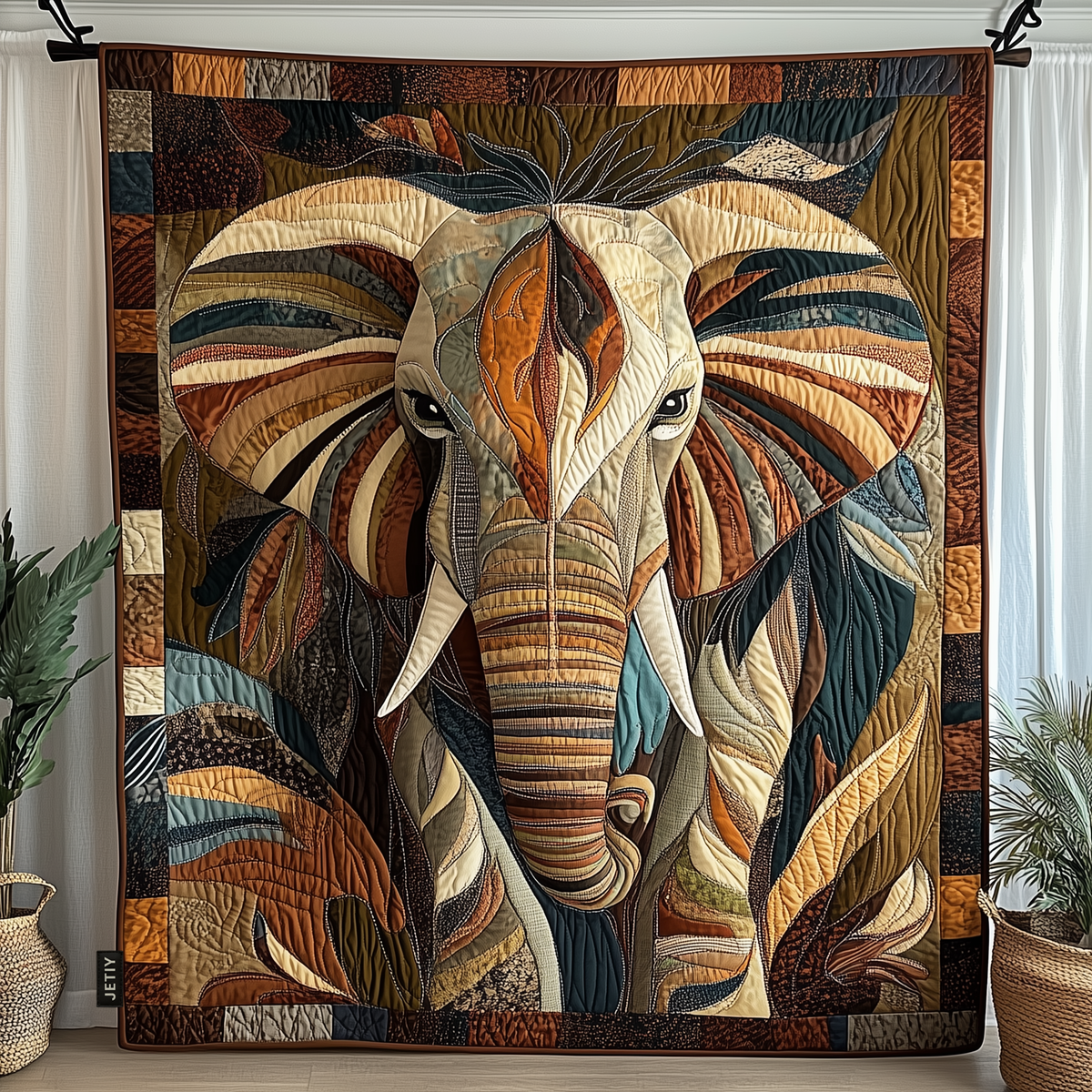 Multicoloured quilted blanket with an elephant patchwork design