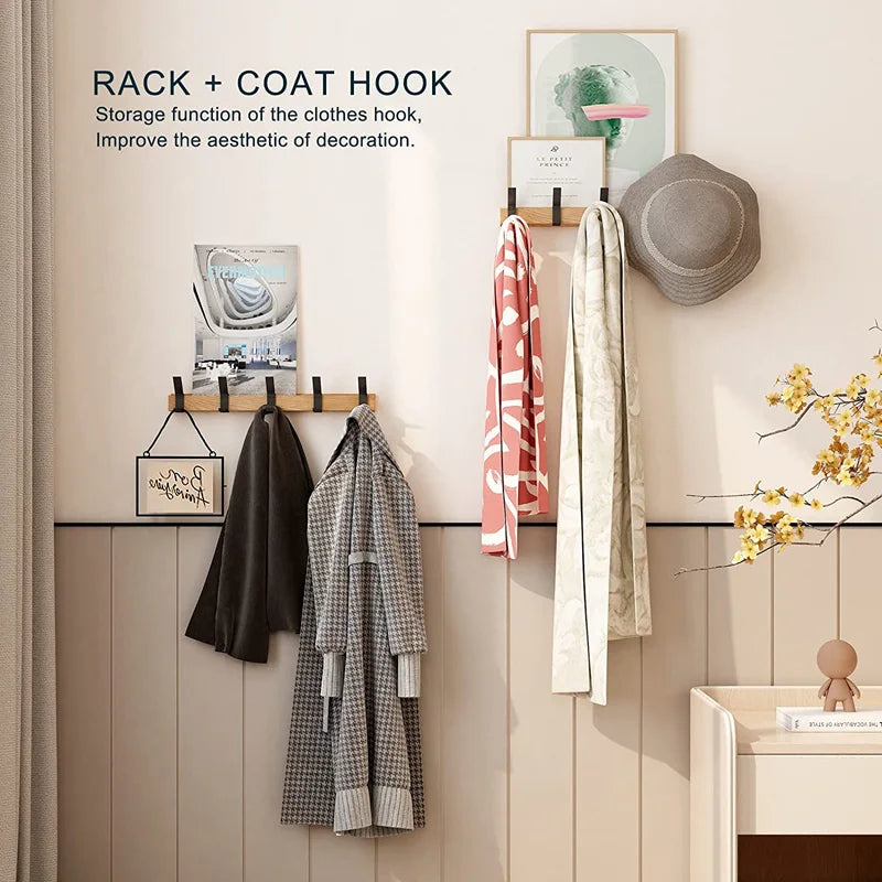 Wall-mounted coat rack with black hooks and a wood-effect rail