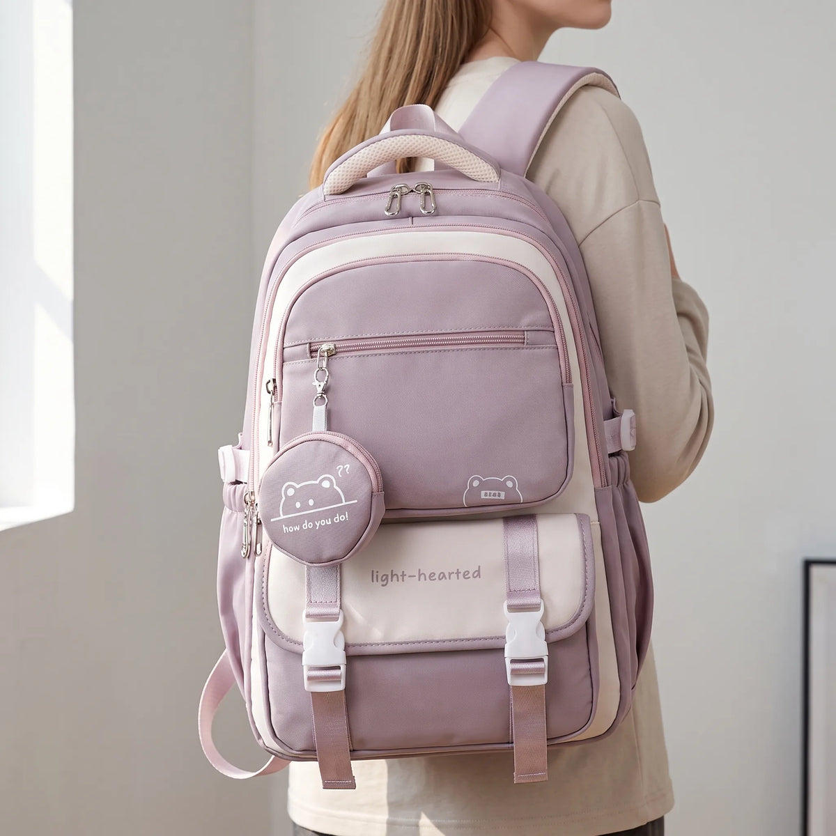 Multi-pocket school backpack with zipped compartments, front pouch and side pockets
