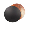 Layered circular LED wall light with an eclipse-inspired design