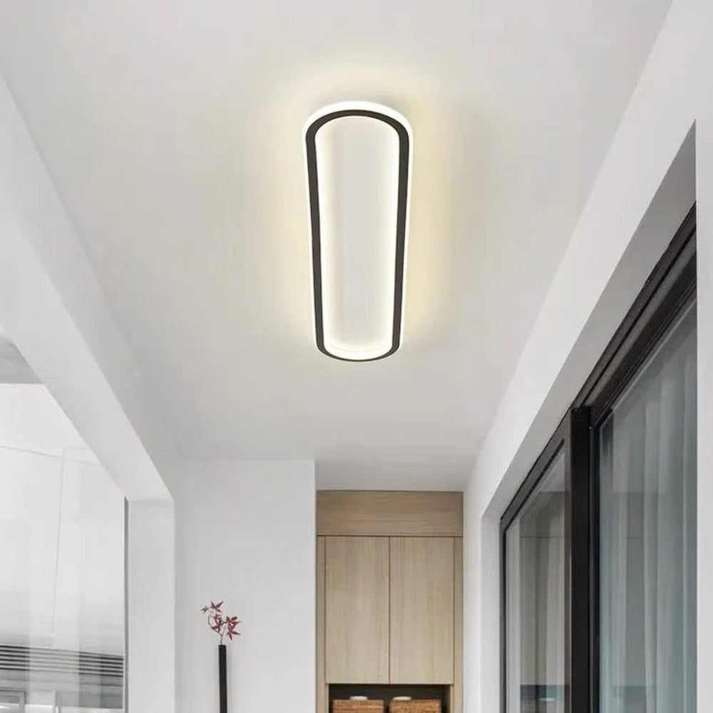 Elongated oval LED ceiling light with a flush-mounted modern design