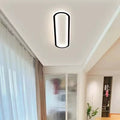 Elongated oval LED ceiling light with a flush-mounted modern design