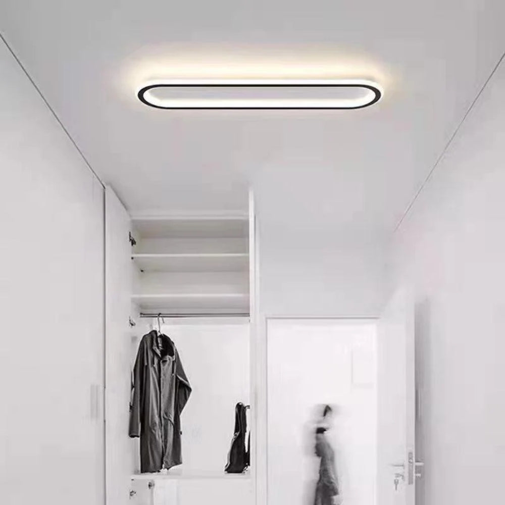 Elongated oval LED ceiling light with a flush-mounted modern design