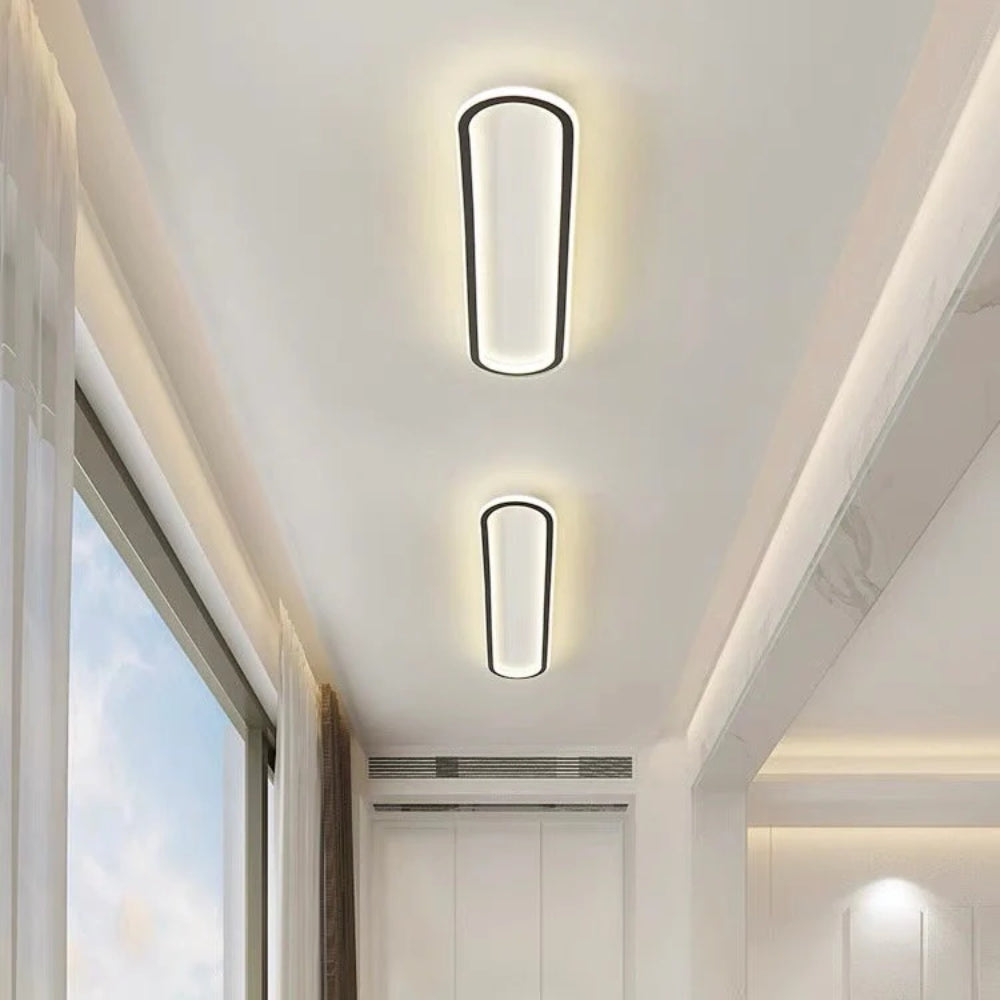 Elongated oval LED ceiling light with a flush-mounted modern design
