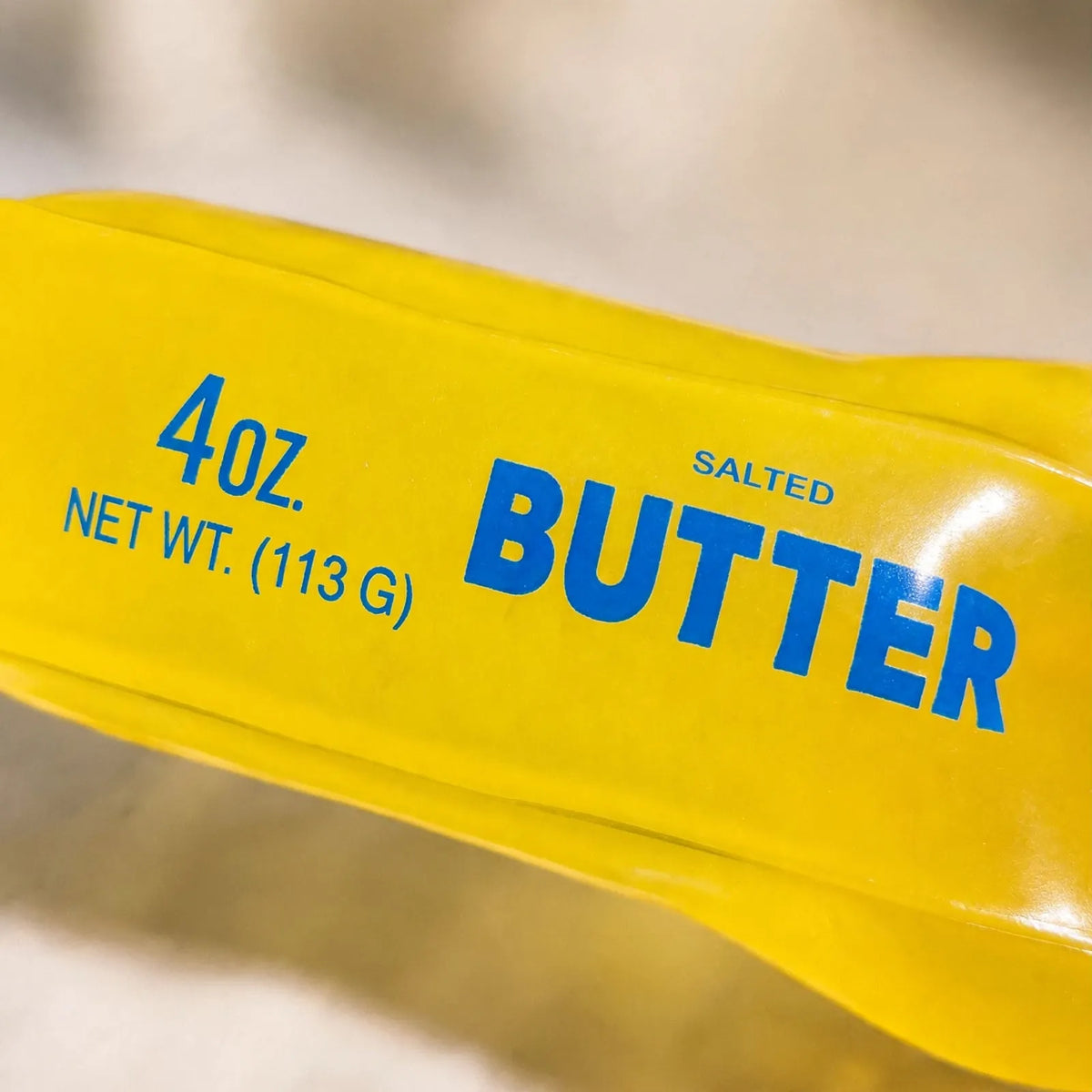 Nubbro - Butter Shaped Sensory Fidget Toy Squeezing It During A Work Break To Ease Restless Hands