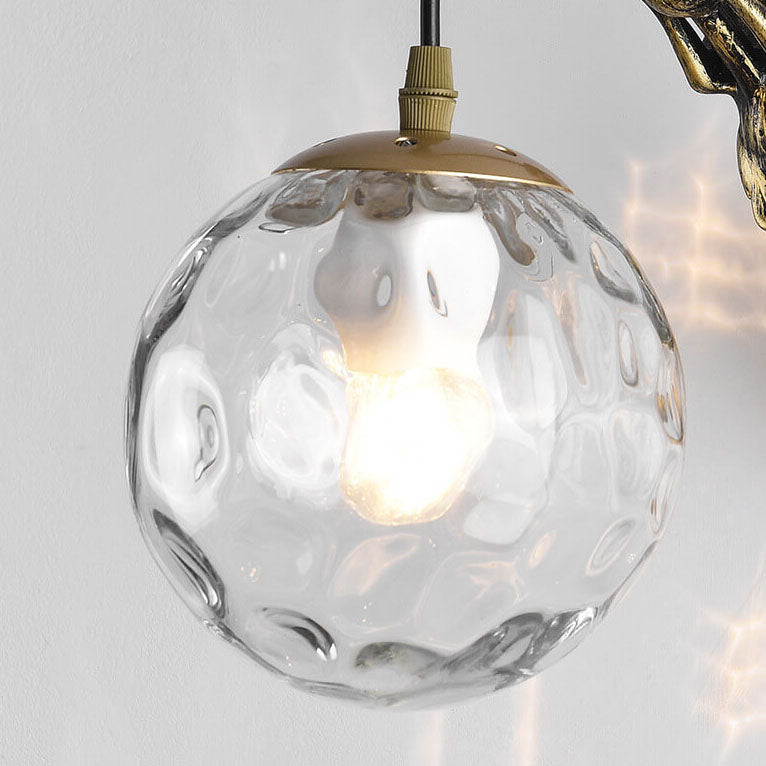 Decorative mermaid wall sconce with textured glass orb