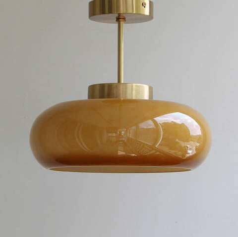 Semi-flush ceiling light with yellow rounded glass shade and brass finish