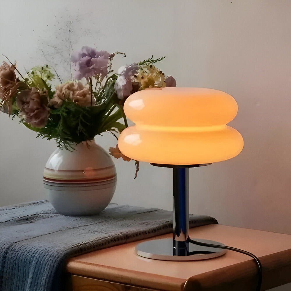 Glass table lamp with rounded two-tier shade and chrome base