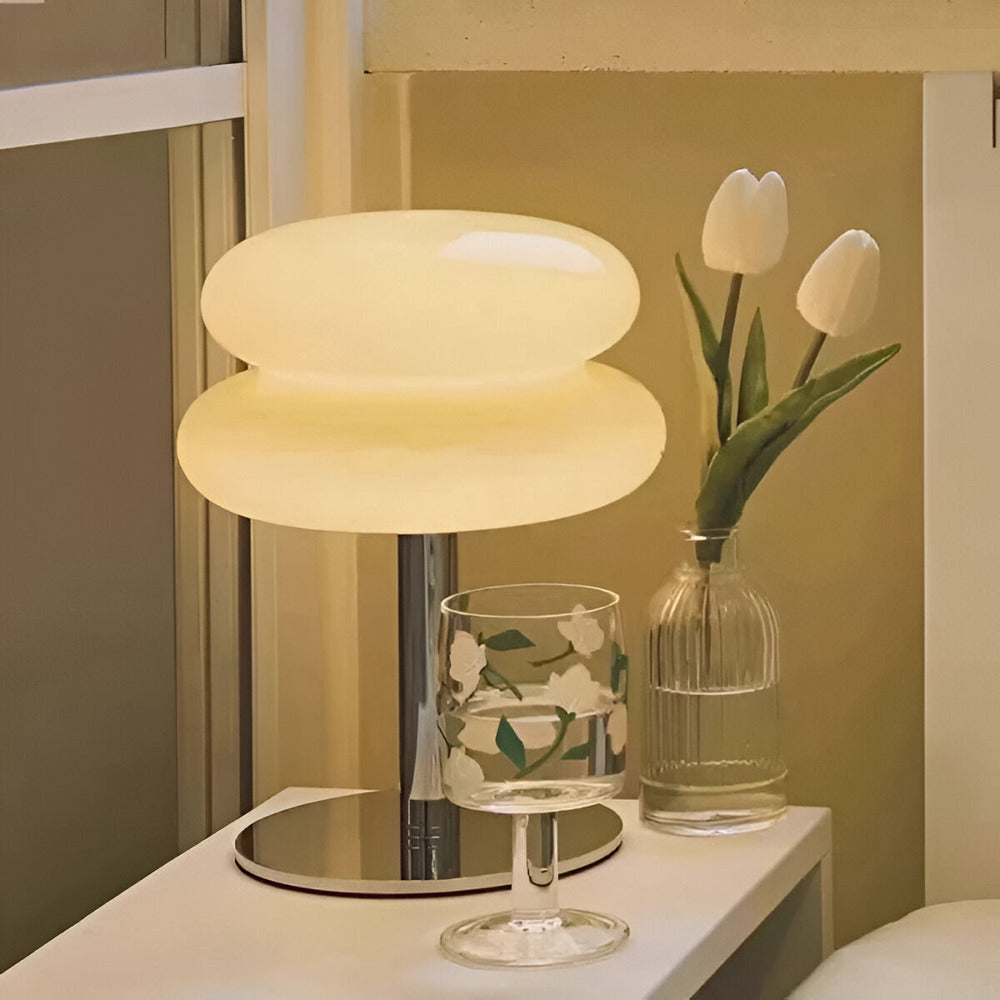 Glass table lamp with rounded two-tier shade and chrome base