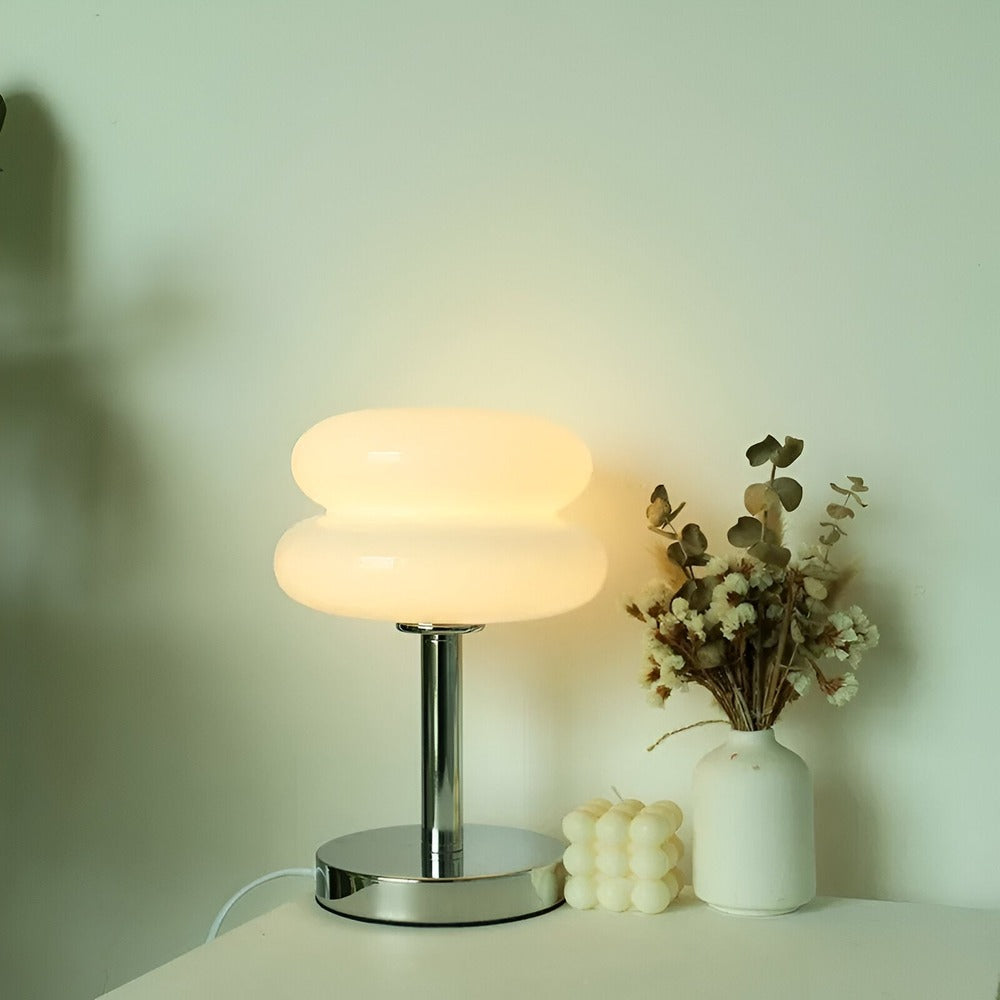 Glass table lamp with rounded two-tier shade and chrome base