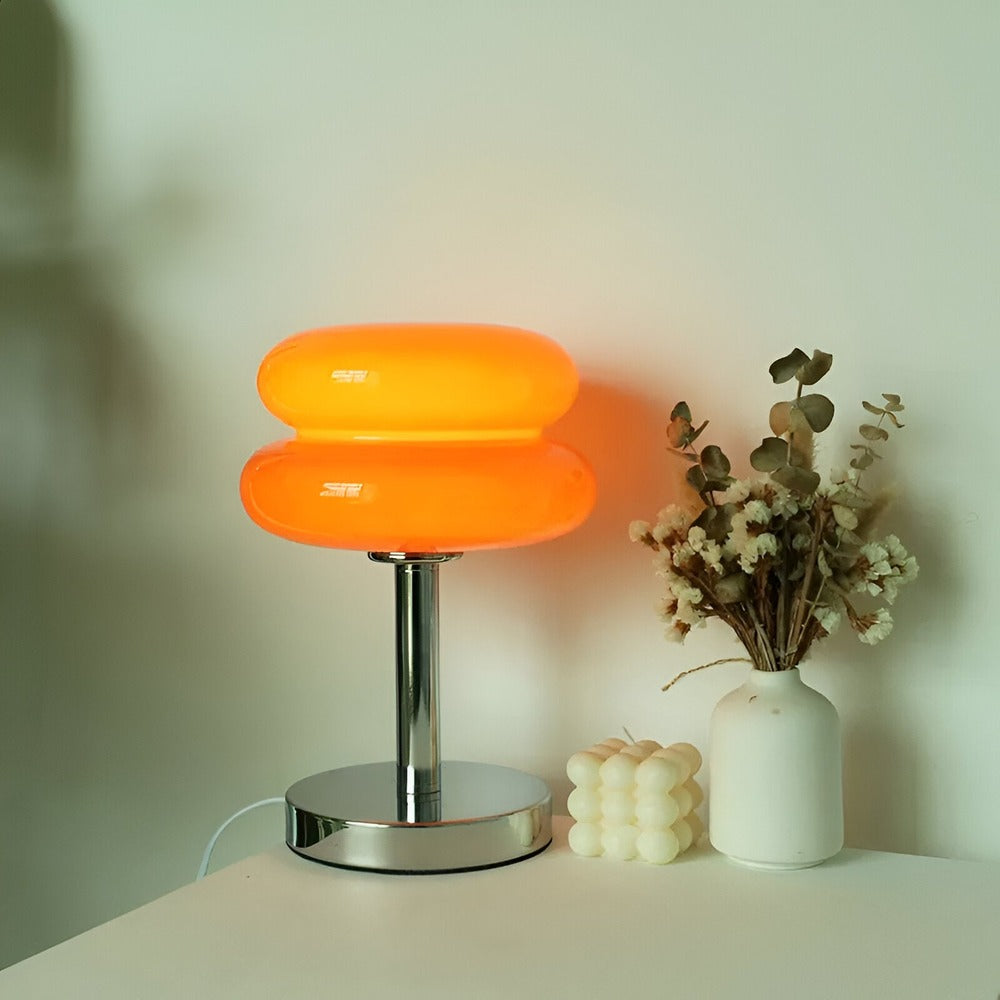 Glass table lamp with rounded two-tier shade and chrome base