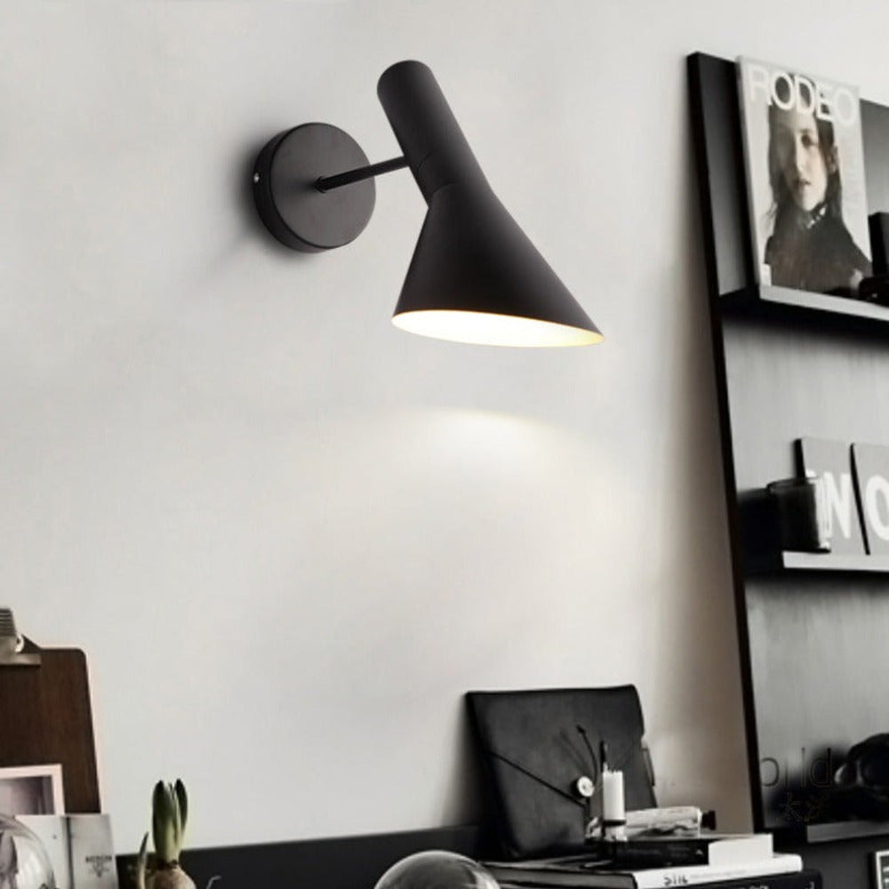 Adjustable LED wall light with a conical shade and round wall mount