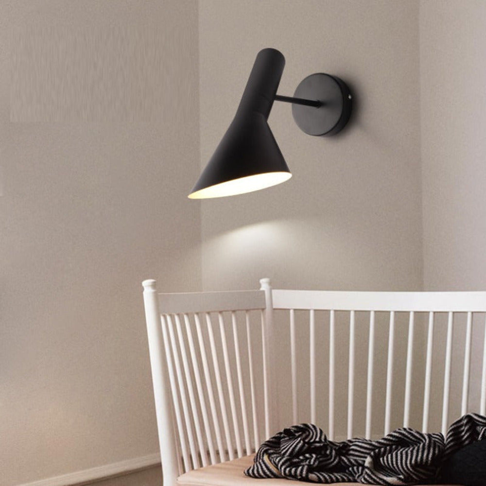 Adjustable LED wall light with a conical shade and round wall mount