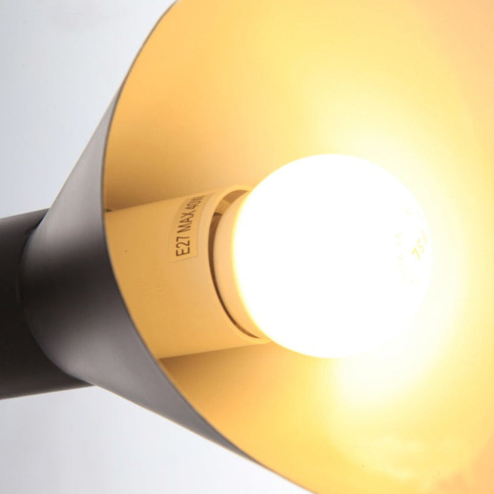 Adjustable LED wall light with a conical shade and round wall mount
