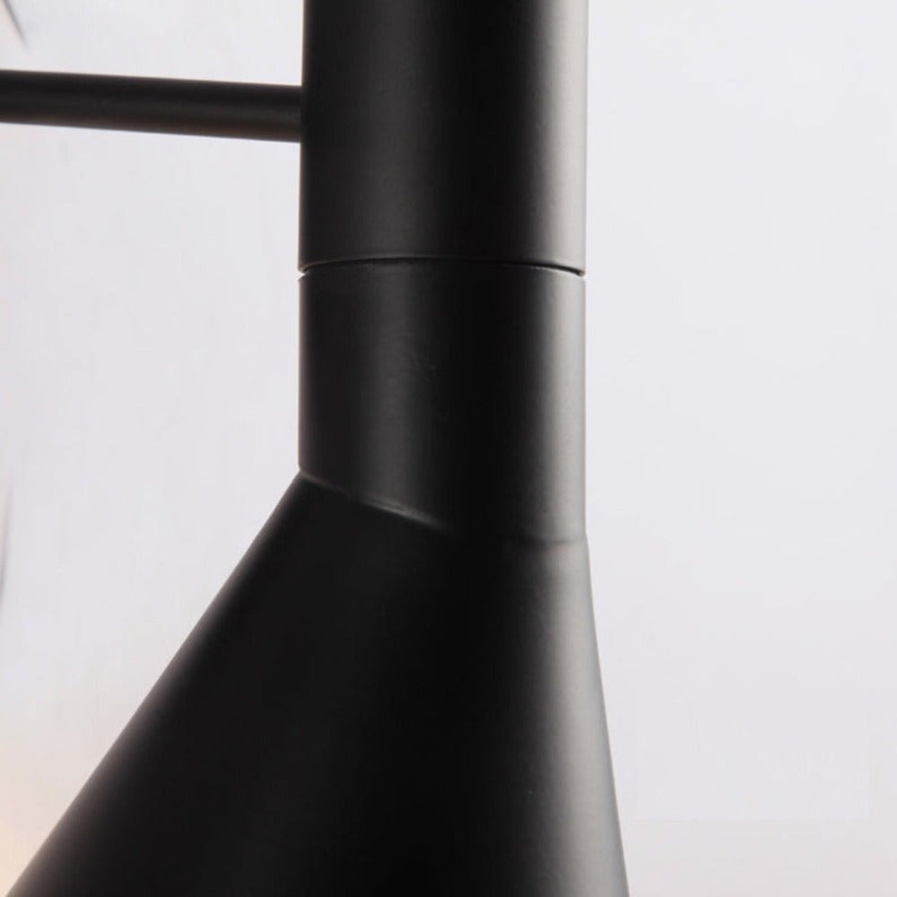 Adjustable LED wall light with a conical shade and round wall mount