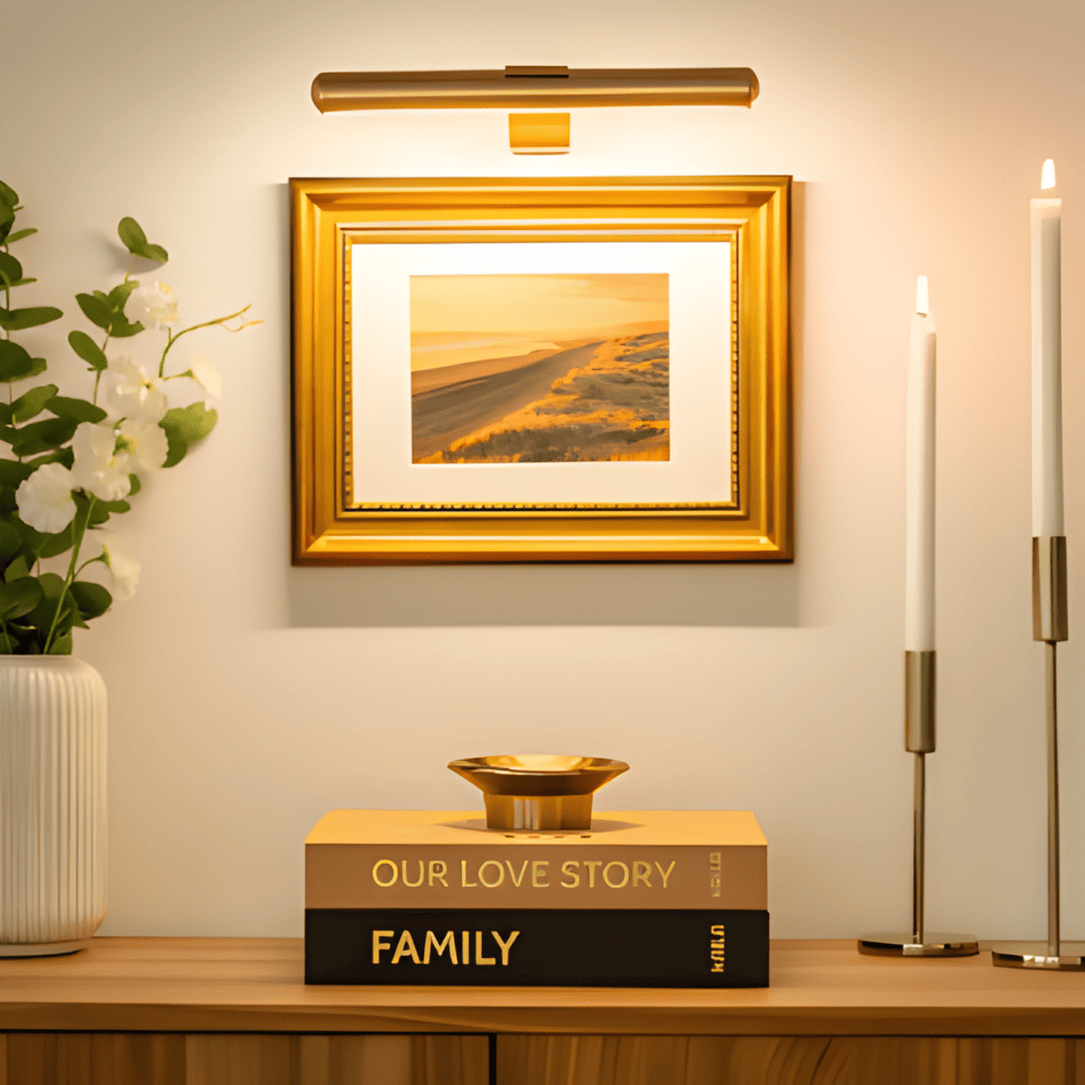 Cordless rotatable LED wall light mounted above framed artwork