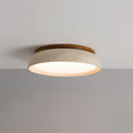 Round flush ceiling light with textured stone-effect surround and wood-effect trim