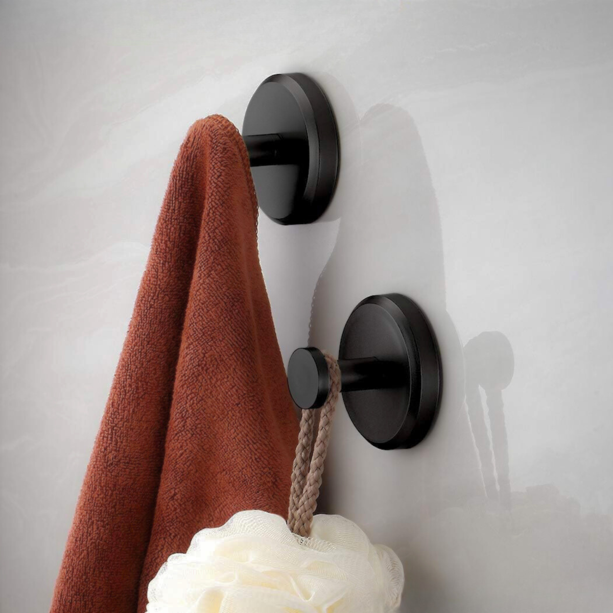 Four round self-adhesive wall hooks for bathroom and kitchen storage