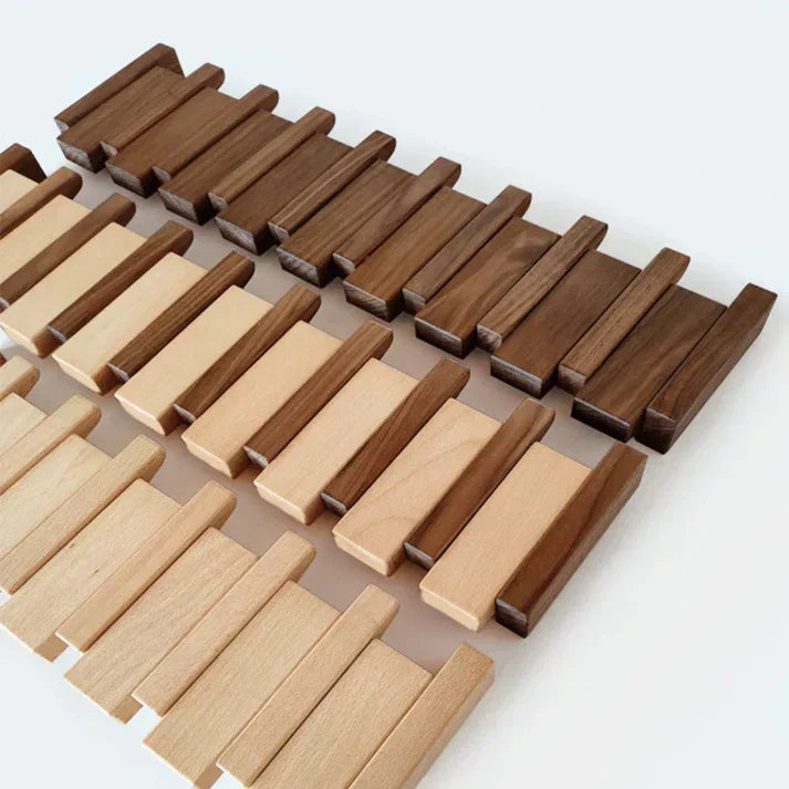 Wooden wall-mounted coat rack with multiple angled hooks