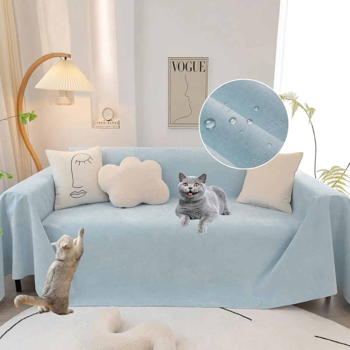 Solid light blue waterproof sofa cover draped over a sofa