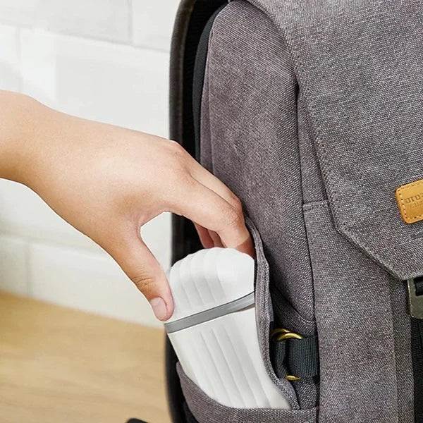 White portable soap case with grey band and red latch