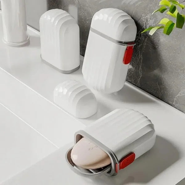 White portable soap case with grey band and red latch