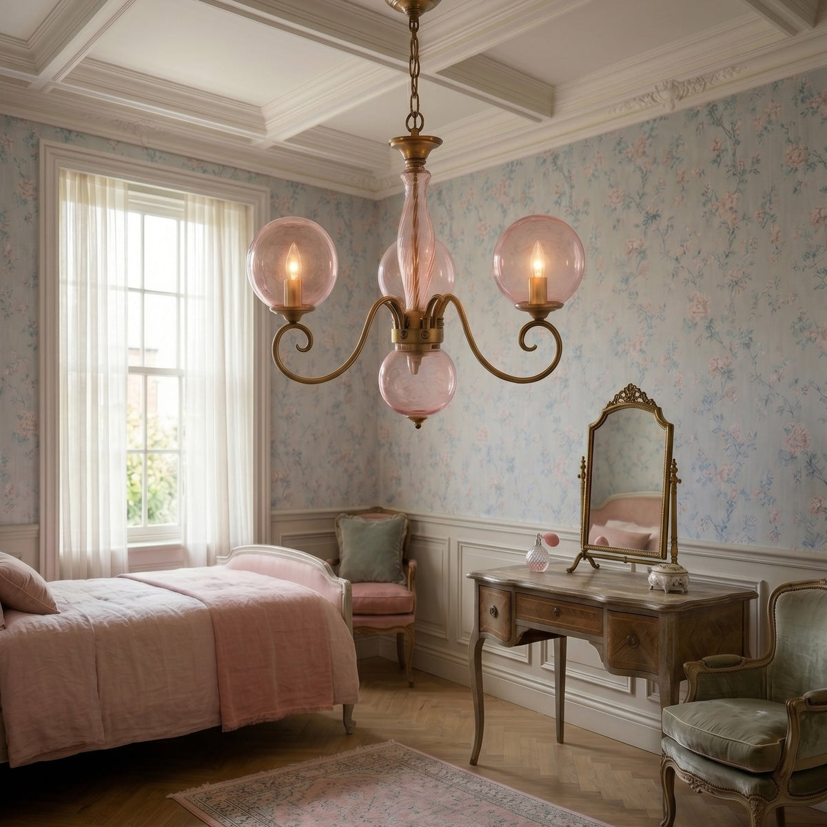 Brass-coloured glass chandelier with pink globes and hanging chain