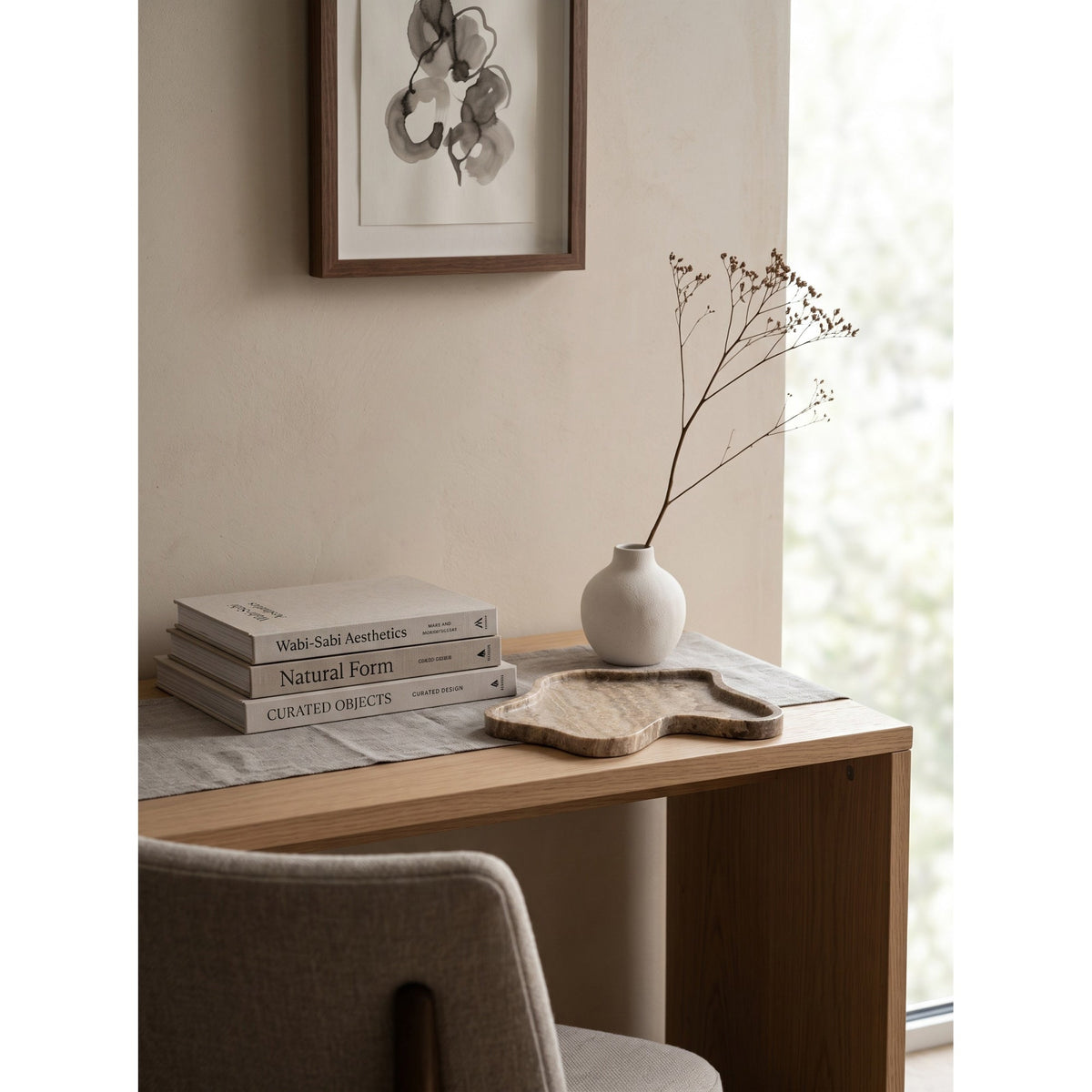 Beige organic-shaped stone decorative tray with raised edge