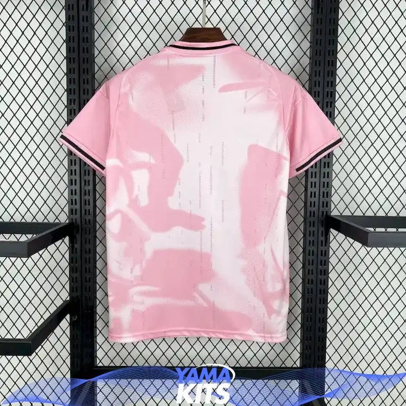 Pink Real Madrid football jersey with abstract pattern and black trim