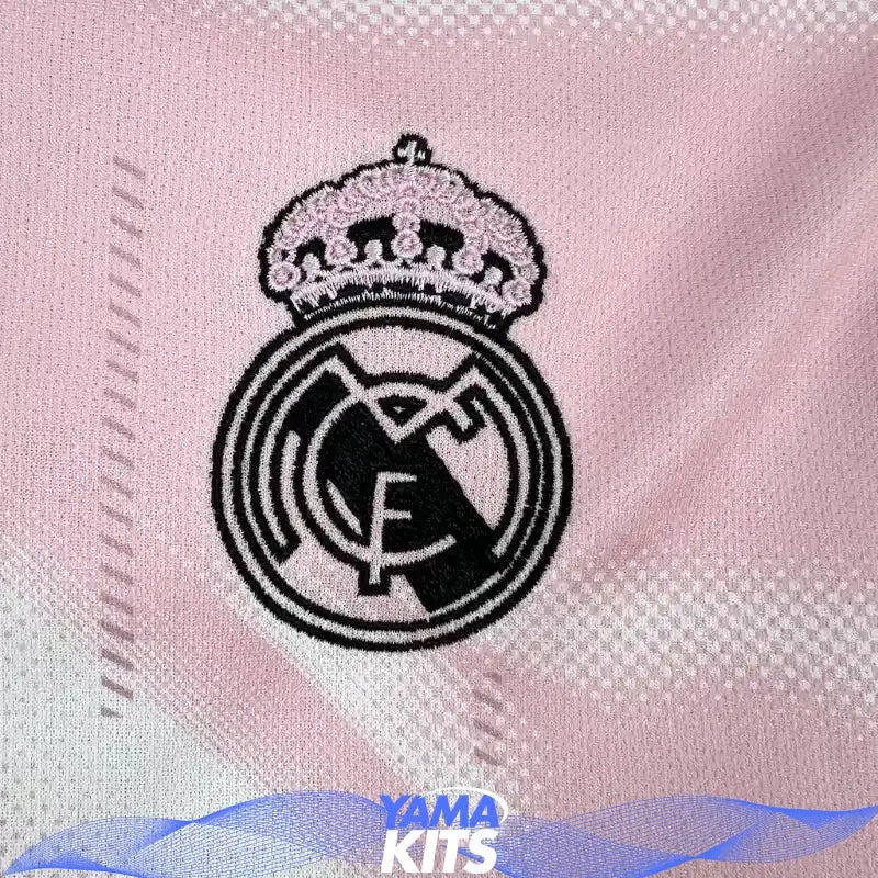 Pink Real Madrid football jersey with abstract pattern and black trim