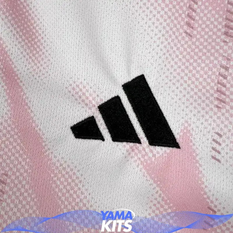 Pink Real Madrid football jersey with abstract pattern and black trim