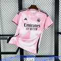 Pink Real Madrid football jersey with abstract pattern and black trim