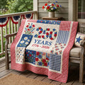 Red blue and cream floral patchwork quilted blanket on an armchair