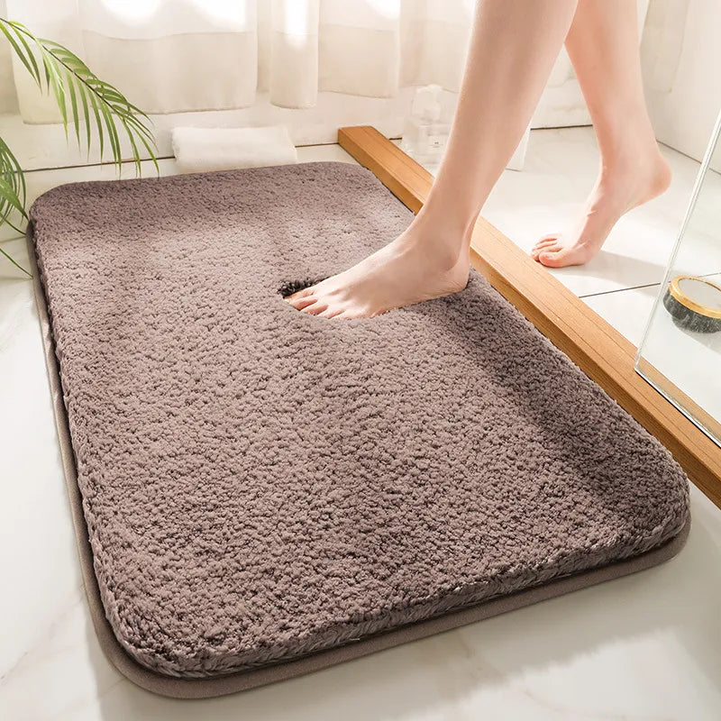 Plush rectangular bathroom mat with soft pile, rounded corners and bound edging