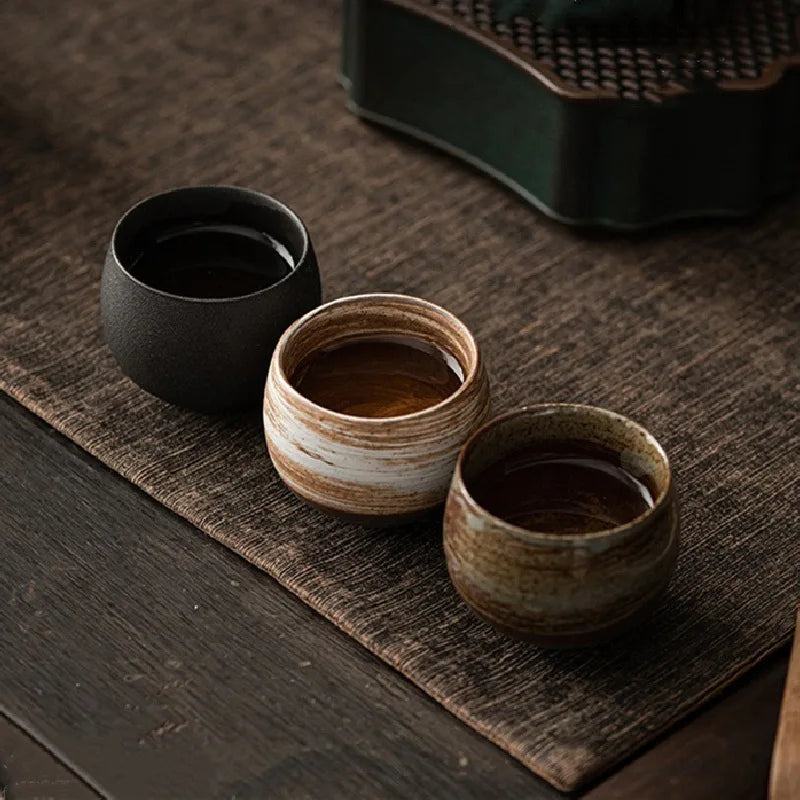Handmade ceramic espresso cups with textured glazed finishes