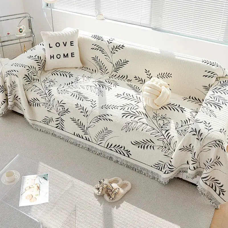 Chenille jacquard sofa cover with botanical leaf pattern and fringed edge