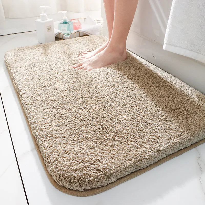Plush rectangular bathroom mat with soft pile, rounded corners and bound edging