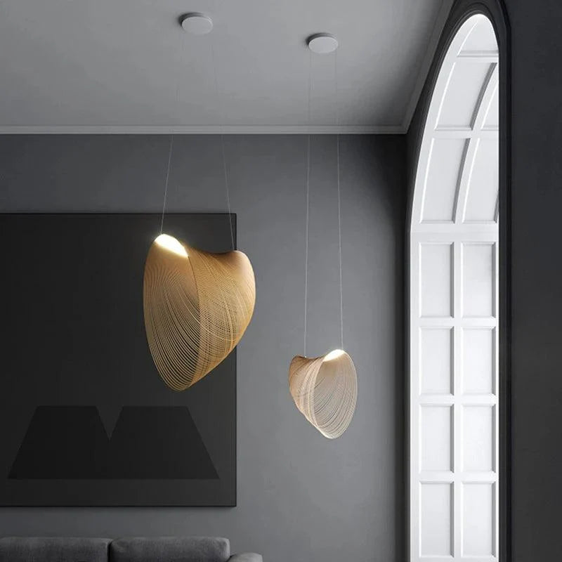 Sculptural pendant light with a curved open wire shade