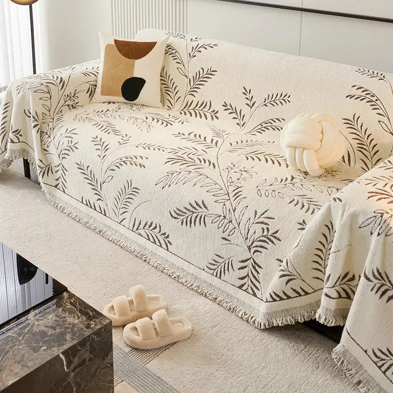 Chenille jacquard sofa cover with botanical leaf pattern and fringed edge