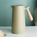 Insulated stainless steel beverage carafe with wooden handle and fitted lid