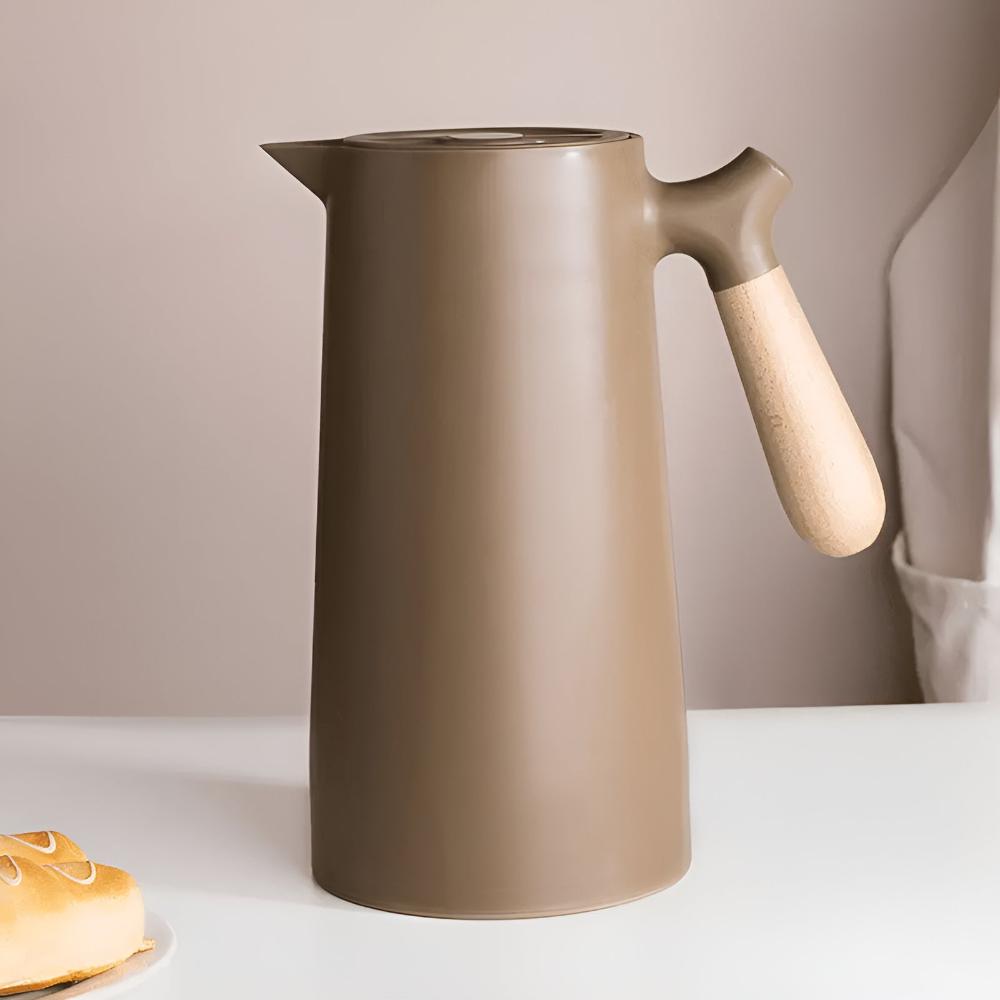 Insulated stainless steel beverage carafe with wooden handle and fitted lid