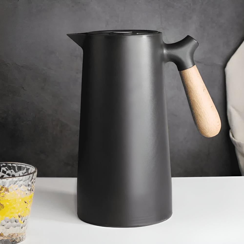 Insulated stainless steel beverage carafe with wooden handle and fitted lid