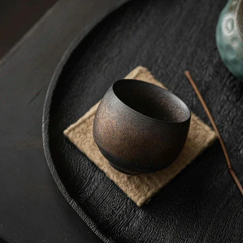 Handmade ceramic espresso cups with textured glazed finishes